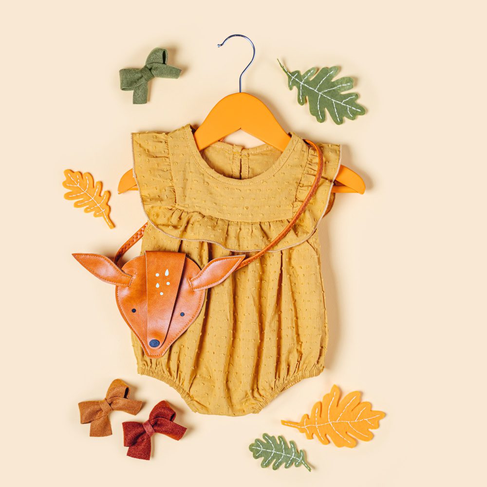 Mother holding baby in soft cotton clothing